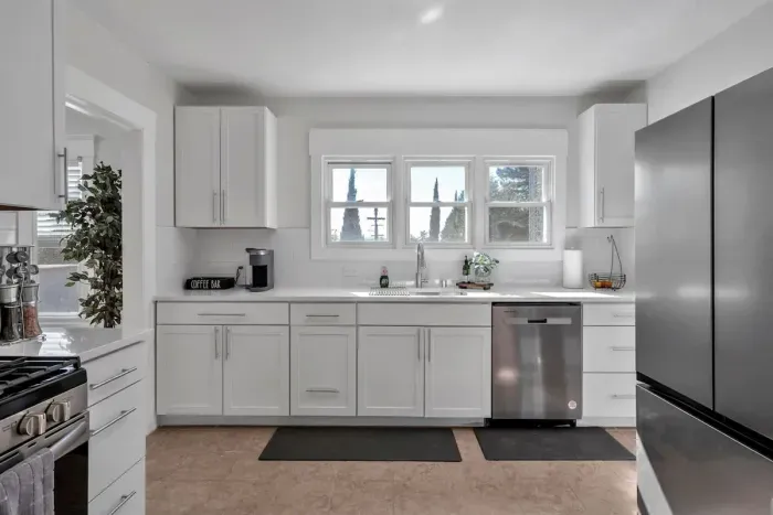 Modern conveniences! Gas stove, dishwasher, refrigerator. Kitchen has Keurig coffee maker, toaster, and blender.