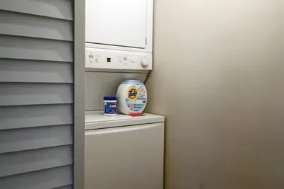 Travel light! Our guest suite includes a convenient stacked washer and dryer with complimentary laundry pods.