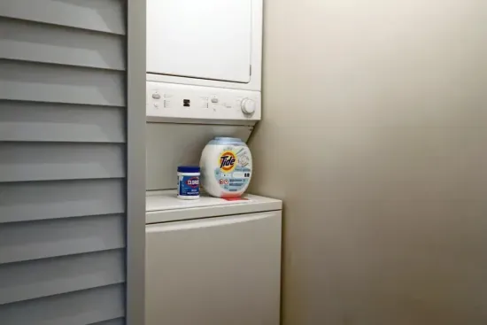 Travel light! Our guest suite includes a convenient stacked washer and dryer with complimentary laundry pods.