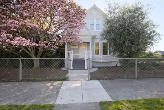 Welcome to your home away from home! Enjoy the blooming magnolia and classic architecture of this charming residence.
