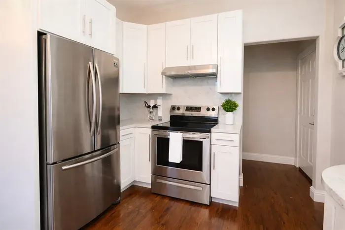 Modern convenience at your fingertips. Features include a deep stainless steel sink, a professional-grade range, and a spacious French-door refrigerator.