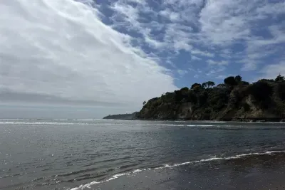 Scenic ocean view from the shoreline at the cliff base.