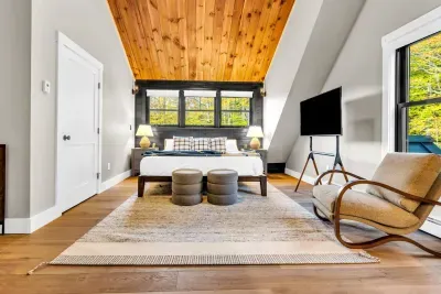 Here we have the 2nd master bedroom, once again fitted with a california king bed, smart TV, and ensuite bathroom!