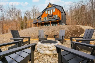 Enjoy s'mores by the fire in comfortable Adirondack chairs as the sun sets!