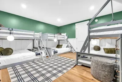 Nestled downstairs is the second bunk room!  Each of the 3 bunks is a twin over full bed, with enough sleeping for 12, just in this room!