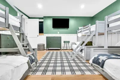 Nestled downstairs is the second bunk room!  Each of the 3 bunks is a twin over full bed, with enough sleeping for 12, just in this room!