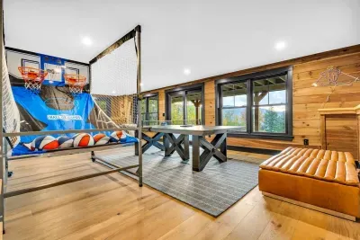 Downstairs, is designed for fun & recreation!  Enjoy the life sized "pop a shot", or ping pong, along with a full seating area around the downstairs fireplace!