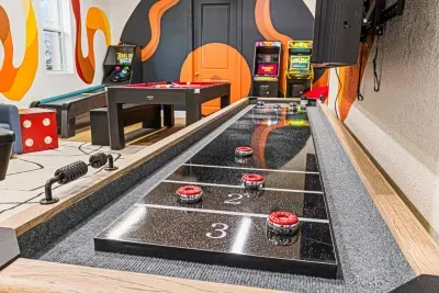 Downstairs is designed for fun & recreation!  Enjoy the life sized air hockey table, shuffle board, pool table, arcade games and a Skee-ball machine!
