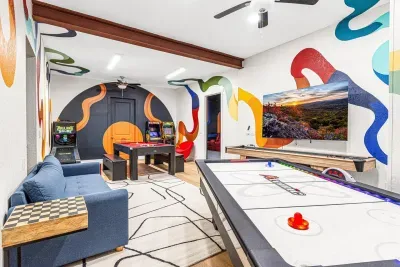 Enjoy this life-sized air hockey table, shuffleboard, pool table, arcade games, and a skee-ball machine!