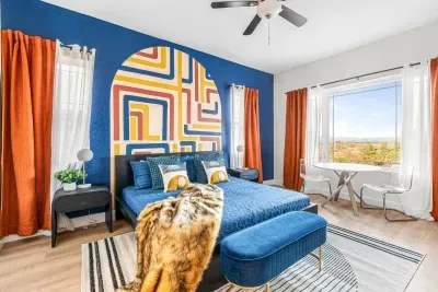 Enjoy one of the best views in the house from this of large guest bedroom downstairs fitted with a king bed, more inspirational artwork, and smart TV!

Private entrance directly from the driveway is perfect for anyone not wanting to take the stairs!