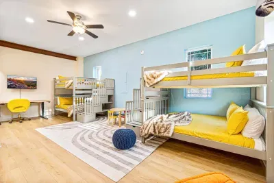 Watch children's faces light up with wonder while surrounded by charming stuffed animals in the uber spacious bunk room!  Both of the bunks is a full over full bed, with enough sleeping for 8, just in this room!
