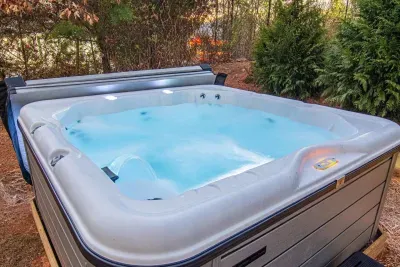 Melt away all your stress in our brand new hot tub that comfortably seats 6 guests.  Settle into relaxation while taking in the views of the mountain line.  New privacy fencing not shown in picture.