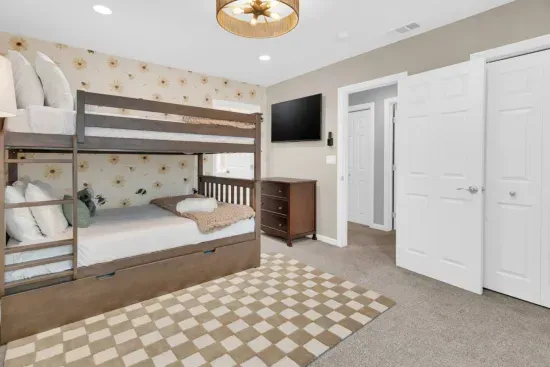 Bedroom 4 (Upstairs) - Kids Room with a bunk and trundle bed. All three mattresses are twin size.
