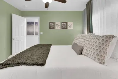 Bedroom 2 (Upstairs) - Queen Size Bed.