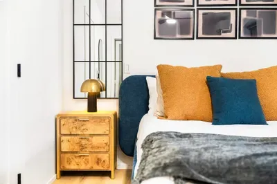 Stylish modern bedroom with plush accents and chic designer details