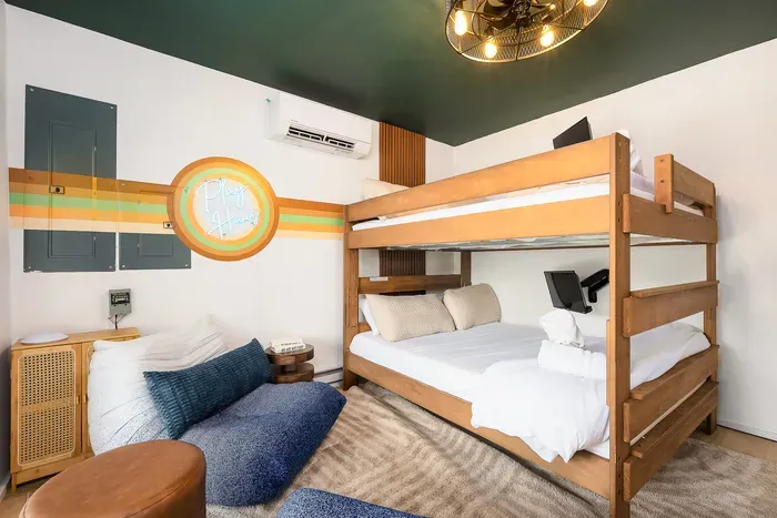 Stylish bunk room with retro accents, cozy bedding, and family-friendly comfort