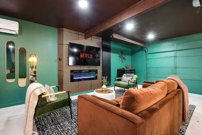 Stylish entertainment lounge with Netflix, fireplace, and cozy modern seating