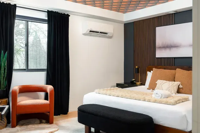 Stylish, cozy bedroom with blackout curtains, AC, and boutique design