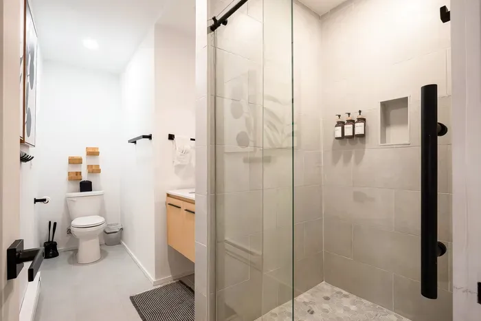 Bright modern bathroom with sleek walk-in glass shower