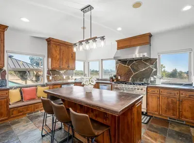 Kitchen - Double oven, Two refrigerators, Wine fridge, Coffee Bar, Views of backyard and Vineyards.