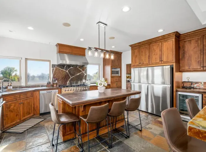 Kitchen - Double oven, Two refrigerators, Wine fridge, Coffee Bar, Views of backyard and Vineyards.