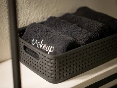 Some black makeup towels are provided to remove makeup at the end of the day.