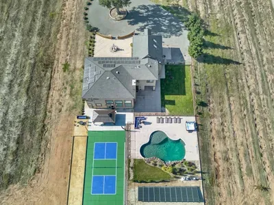 View from top back of the home featuring Pickleball, Bocceball, Firepit, Pool, Hot Tub