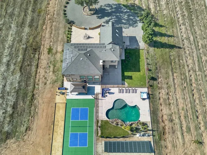 View from top back of the home featuring Pickleball, Bocceball, Firepit, Pool, Hot Tub