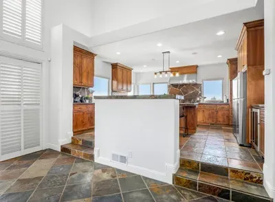 Kitchen - Double oven, Two refrigerators, Wine fridge, Coffee Bar, Views of backyard and Vineyards.