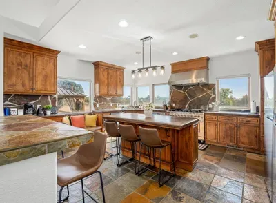 Kitchen - Double oven, Two refrigerators, Wine fridge, Coffee Bar, Views of backyard and Vineyards.