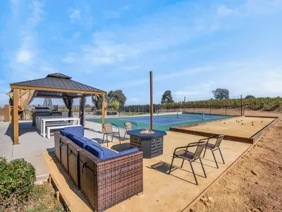 Outdoor - Pickleball court, Bocceball court, Firepit, Outdoor kitchen and dining.