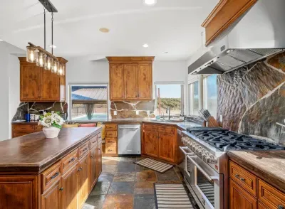Kitchen - Double oven, Two refrigerators, Wine fridge, Coffee Bar, Views of backyard and Vineyards.