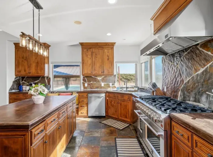 Kitchen - Double oven, Two refrigerators, Wine fridge, Coffee Bar, Views of backyard and Vineyards.