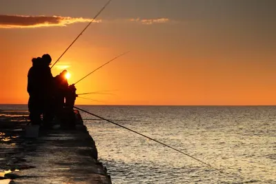 fishermen-at-sunrise-on-the-sea