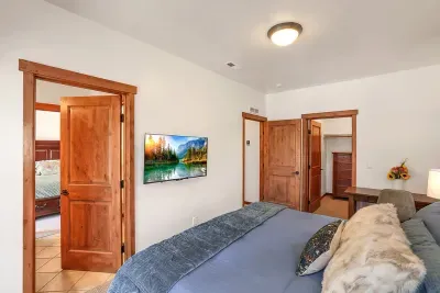 Convenient Comfort: Featuring a smart TV and ample closet space, this guest bedroom provides all the comforts of home, plus a little extra.