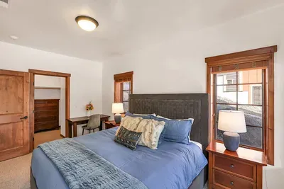 Relaxation Ready: With its calming color palette and plush bedding, the guest bedroom is designed to ensure a peaceful retreat for a great night's sleep.