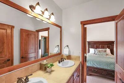 Shared Convenience: The Jack and Jill bathroom offers an ideal setup for guests, connecting two bedrooms for easy access while maintaining privacy.