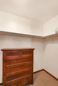Organized Elegance: The spacious walk-in closet offers ample room to keep your belongings organized and out of sight, providing a clutter-free environment for a truly relaxing stay.