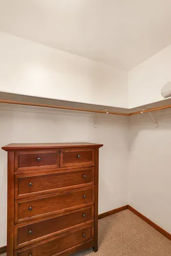 Organized Elegance: The spacious walk-in closet offers ample room to keep your belongings organized and out of sight, providing a clutter-free environment for a truly relaxing stay.