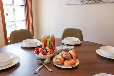 Modern Comfort: Featuring contemporary furnishings and elegant decor, the dining room blends style with comfort, perfect for both casual breakfasts and formal dinners.