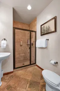 Effortless Accessibility: The main floor full bathroom, complete with a walk-in shower, offers ultimate convenience for a refreshing rinse after a day of adventure.
