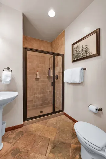 Effortless Accessibility: The main floor full bathroom, complete with a walk-in shower, offers ultimate convenience for a refreshing rinse after a day of adventure.