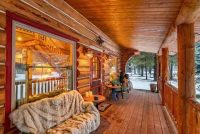 When the weather rolls in, stay outside anyway—the covered porch is made for watching clouds and listening to the rain on the roof