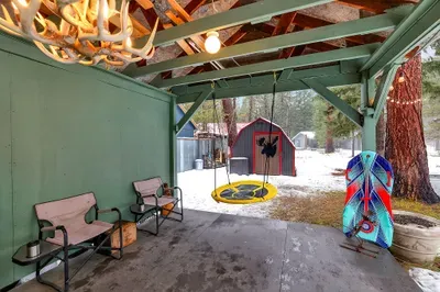 This is where camp really happens: long table, string lights, and room for card games, s’mores, and slow porch suppers