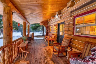 Step onto the porch and into simple cabin comfort—woods first, comforts close