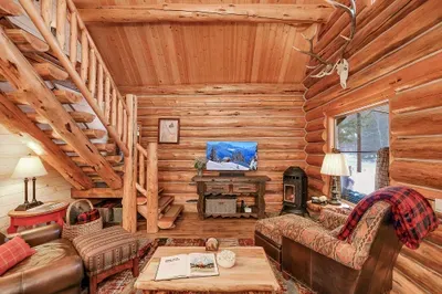 Drop your bags, sink into the sofa, and let the pellet stove glow and timber beams tell you you’re off the clock