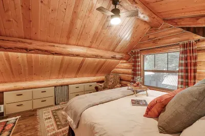 Wood grain, simple lines, and a private bath make the primary feel like your own little hideaway under the roof (6 drawers are locked for storage)