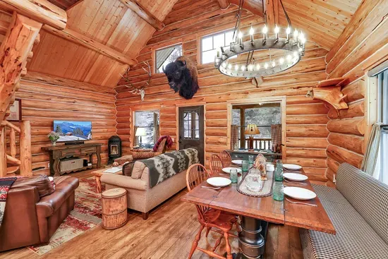 At night, lamps low and stove humming, the living room feels like the cabins you remember, just with better heat and softer seats