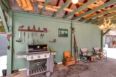 Gas or charcoal—pick your fire. The grills sit side by side, ready for burgers after Ponderosa or steaks after the lake (camp-style charcoal grill just out of frame to the left)
