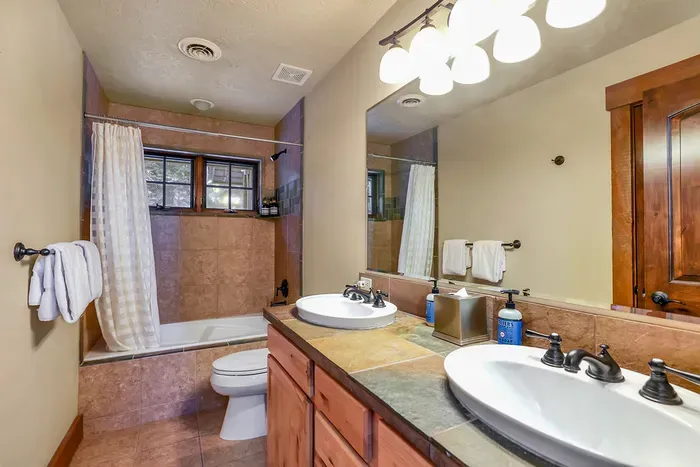 Simple, clean bathrooms with plenty of space for shared mornings (2nd floor bathroom)